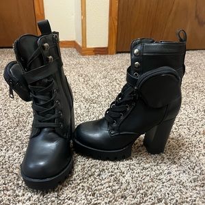 Black heeled boot with boot zipper bag.